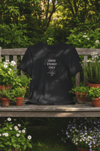 Black T-shirt with crew neck and “GOOD ENERGY ONLY” graphic on the front