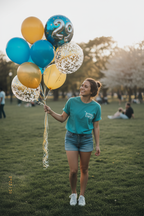 Teal Birthday Energy T-shirt worn by child with small front graphic and crew neck