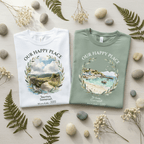 Personalised crew-neck T-shirts, white and muted green, with scenic circular wreath graphic