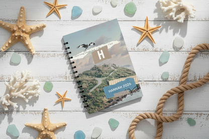 Overhead view of HANNAH notebook with coastal elements