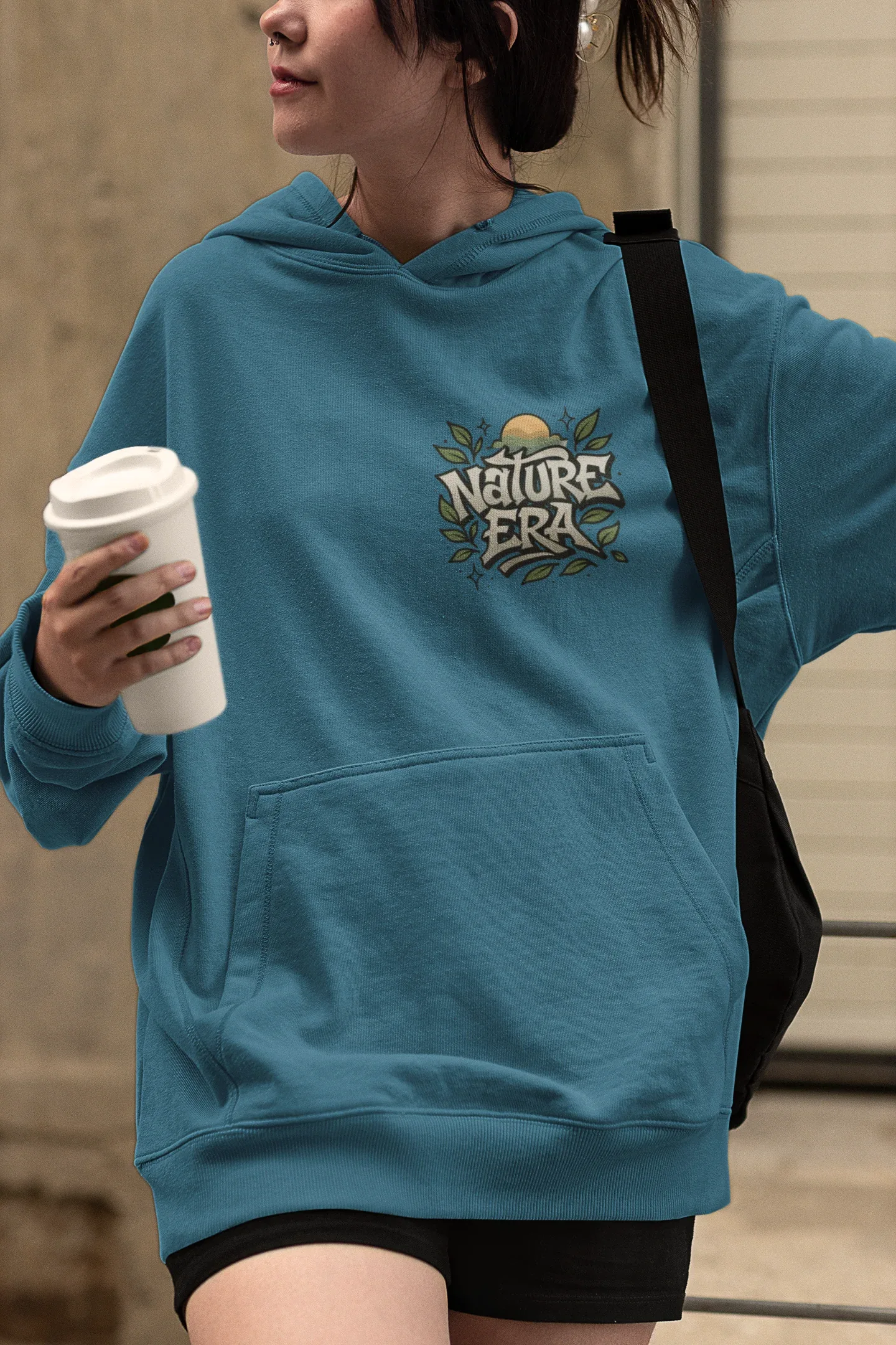 Teal Nature Era hoodie with front logo and kangaroo pocket.
