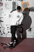 White graphic hoodie with small chest “Mildly Feral” logo, front pouch pocket and hood