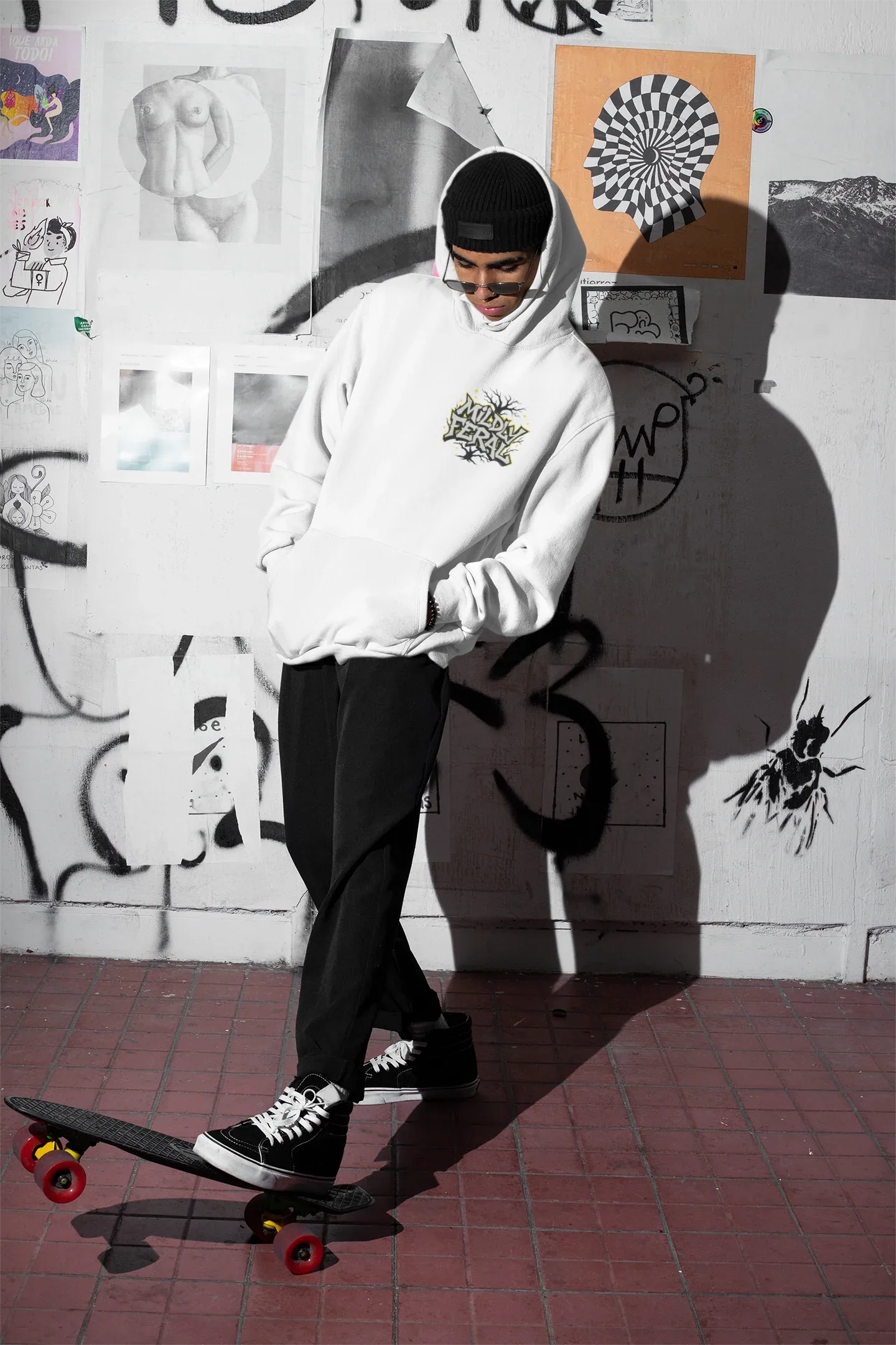 White graphic hoodie with small chest “Mildly Feral” logo, front pouch pocket and hood