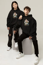 Black hoodie on two models, each with cat-and-art chest graphic