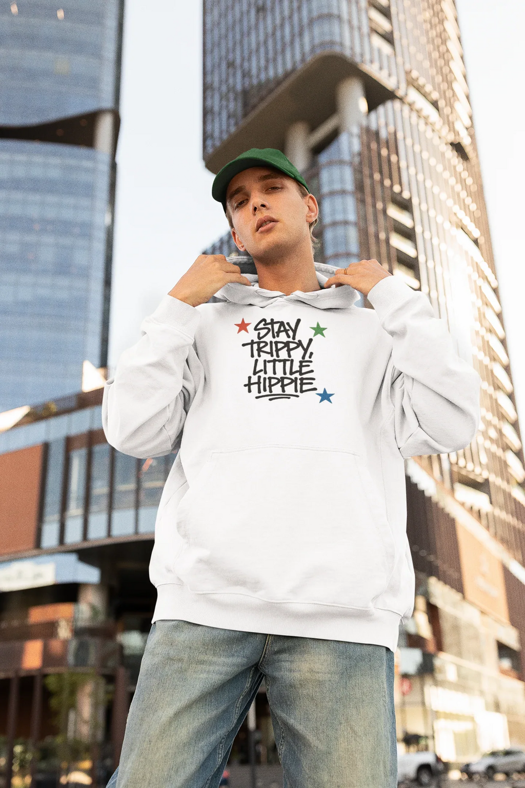 White hoodie with chest "Stay Trippy Little Hippie" star text graphic