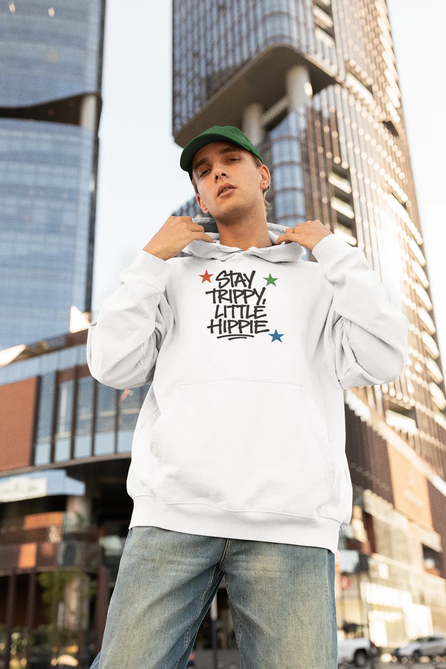 White hoodie with chest "Stay Trippy Little Hippie" star text graphic