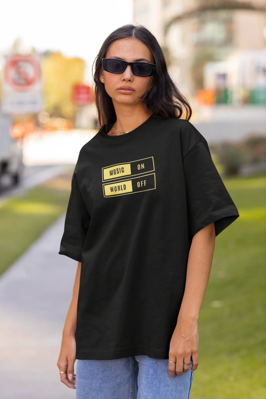 Black unisex graphic T-shirt with “MUSIC ON” and “WORLD OFF” box print on chest
