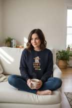 Navy sloth graphic sweatshirt with “Don't Rush Me” text on the chest