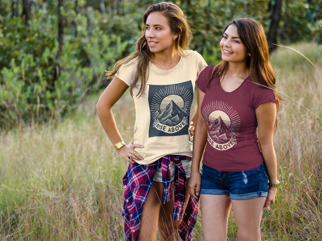 Beige short-sleeve T-shirt with mountain sunrise “RISE ABOVE” graphic on model