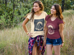 Beige short-sleeve T-shirt with mountain sunrise “RISE ABOVE” graphic on model