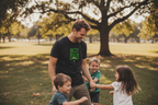 Black men’s T-shirt with small green “BEST DAD” chest print