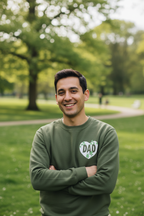 Sweatshirt, green crewneck with DAD heart logo, worn by man