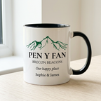 Pen y Fan mug with Our happy place and Sophie & James on a pale oak table