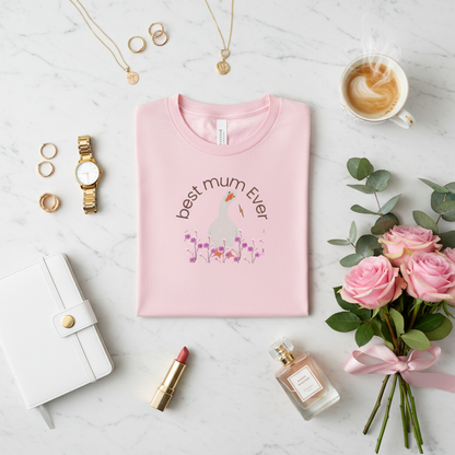 Pink t-shirt on marble with designer items