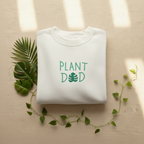 Arctic white crewneck sweatshirt with Plant Dad graphic on the front, long sleeves