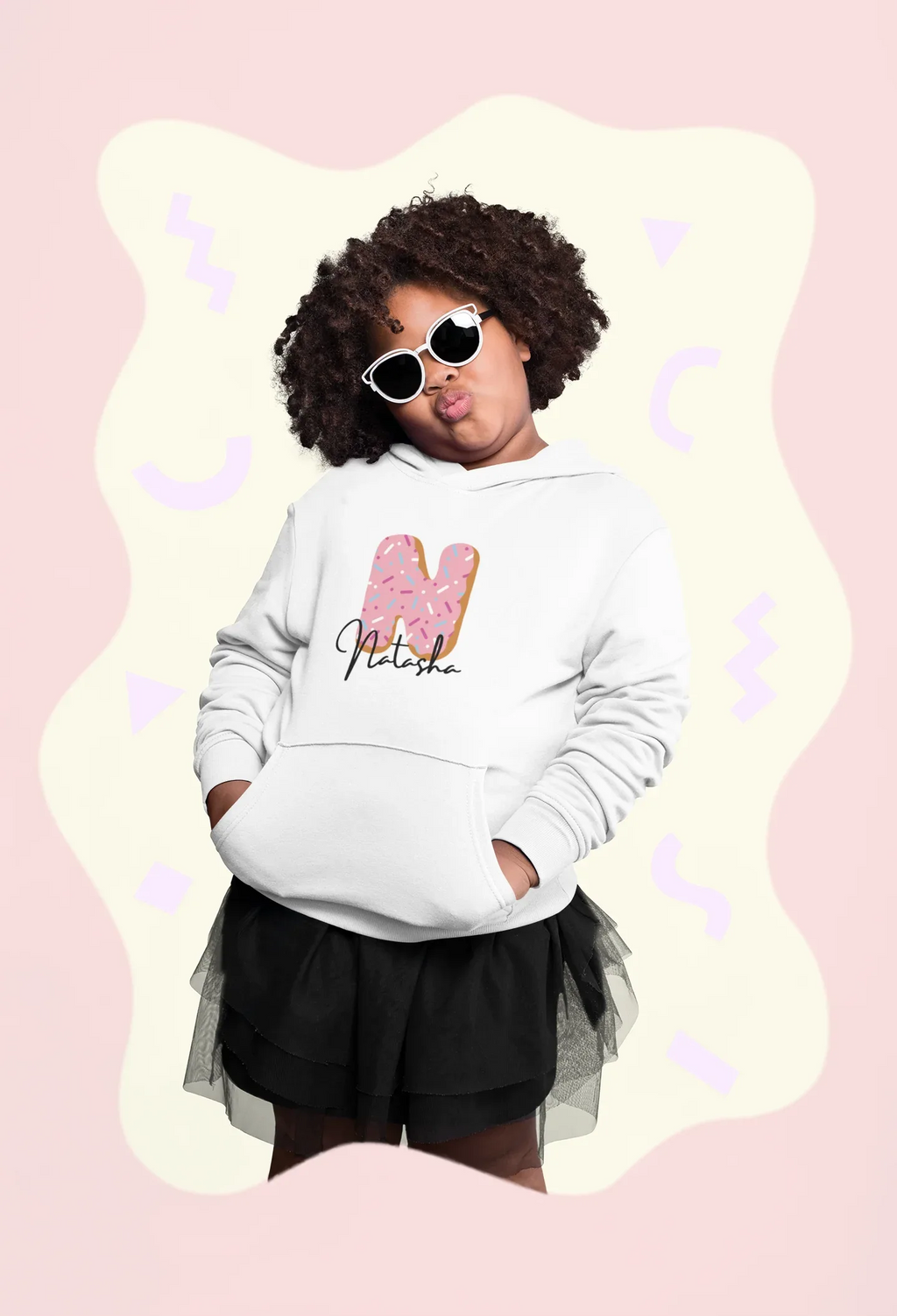 White kids hoodie with hood and pink donut graphic with name text on the chest.