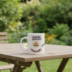 White ceramic mug with “EVERYTHING WILL BE OKAY” and “I’M STRONG” text
