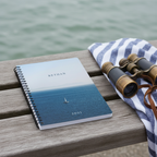 Premium coastal mockup of the Bethan 2001 calm sea notebook