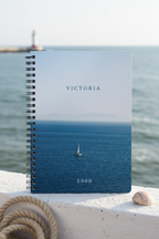 Premium coastal mockup of the Victoria 2000 calm sea notebook