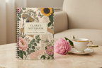 Premium mockup of the Clara notebook on travertine