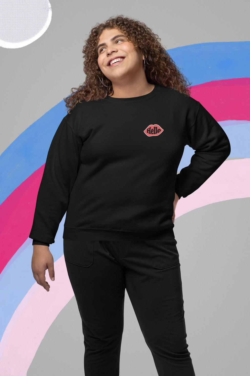 Black crewneck sweatshirt with embroidered lip logo on left chest.