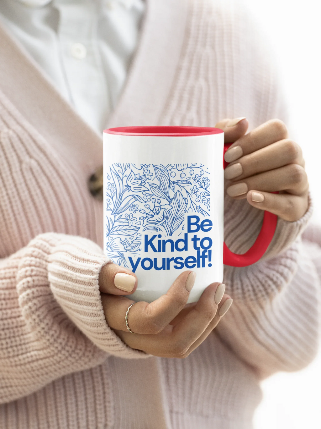 Red accent coffee mug with blue floral line art and 'Be Kind to yourself!' text