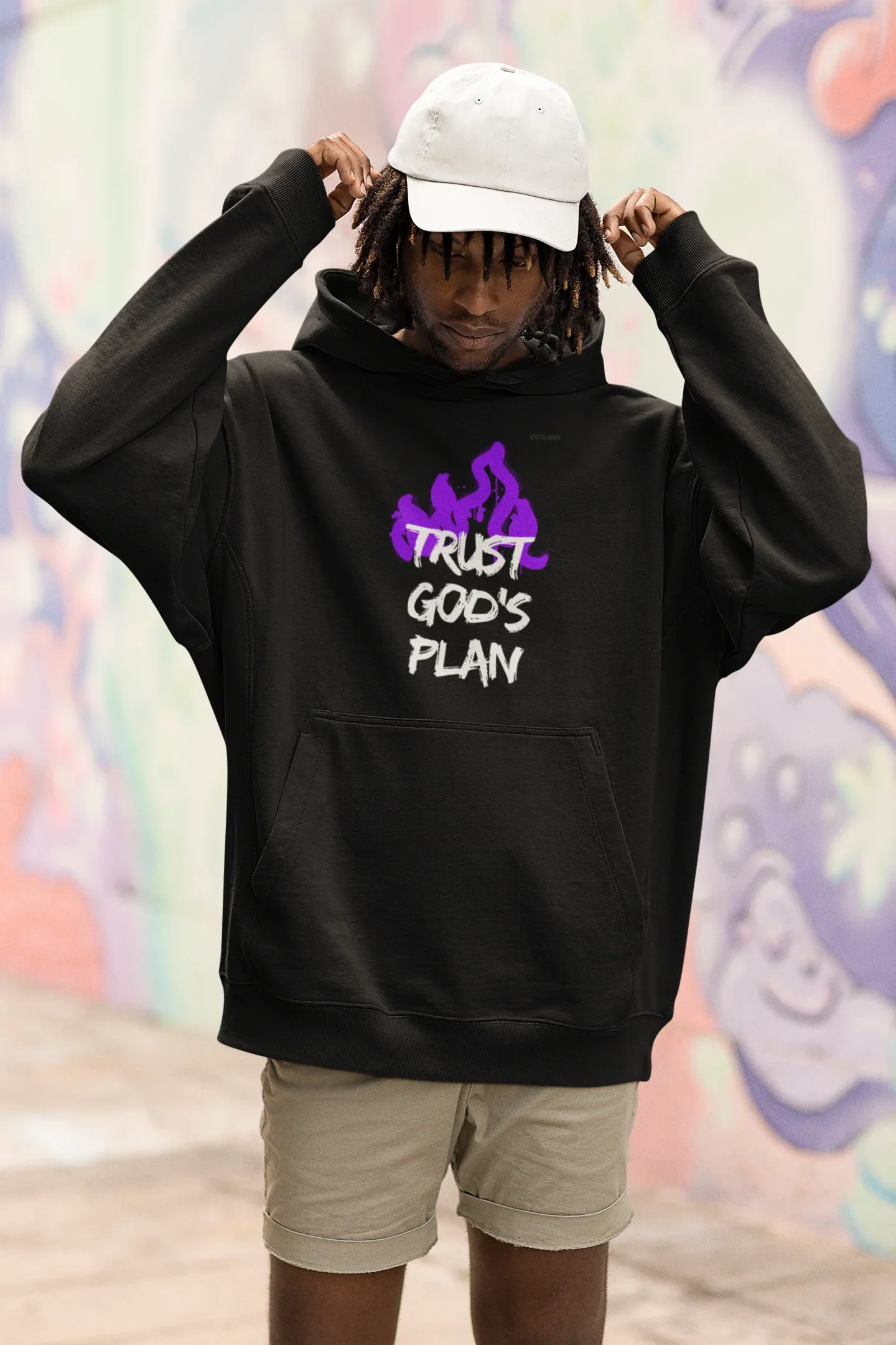 Black hoodie with hood up, front pouch pocket, and purple flame-style text graphic.
