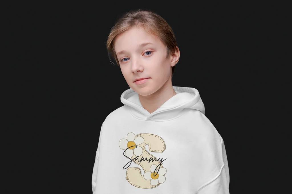 Kids white hoodie on a child with hood and floral name graphic at center chest