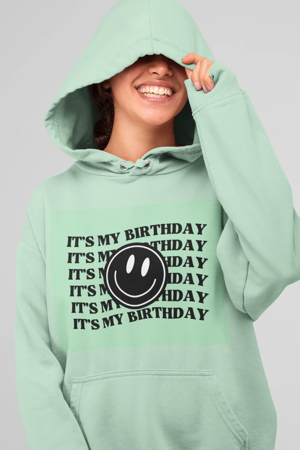 Mint green hooded sweatshirt with kangaroo pocket and birthday logo graphic print