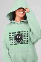 Mint green hooded sweatshirt with kangaroo pocket and birthday logo graphic print