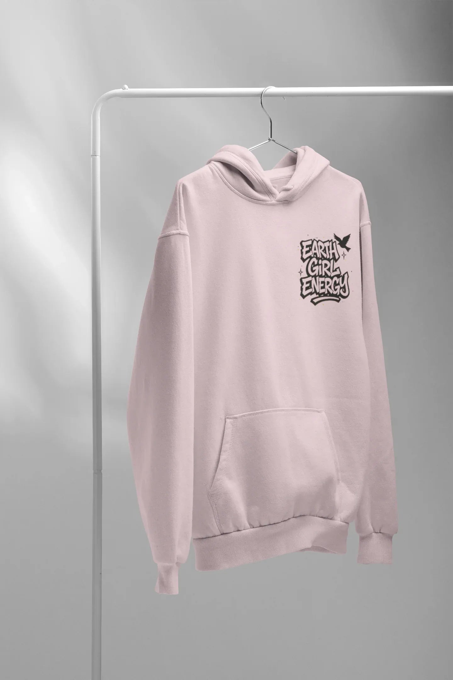 Light pink hoodie with hood, front pocket, and Earth Girl Energy chest logo