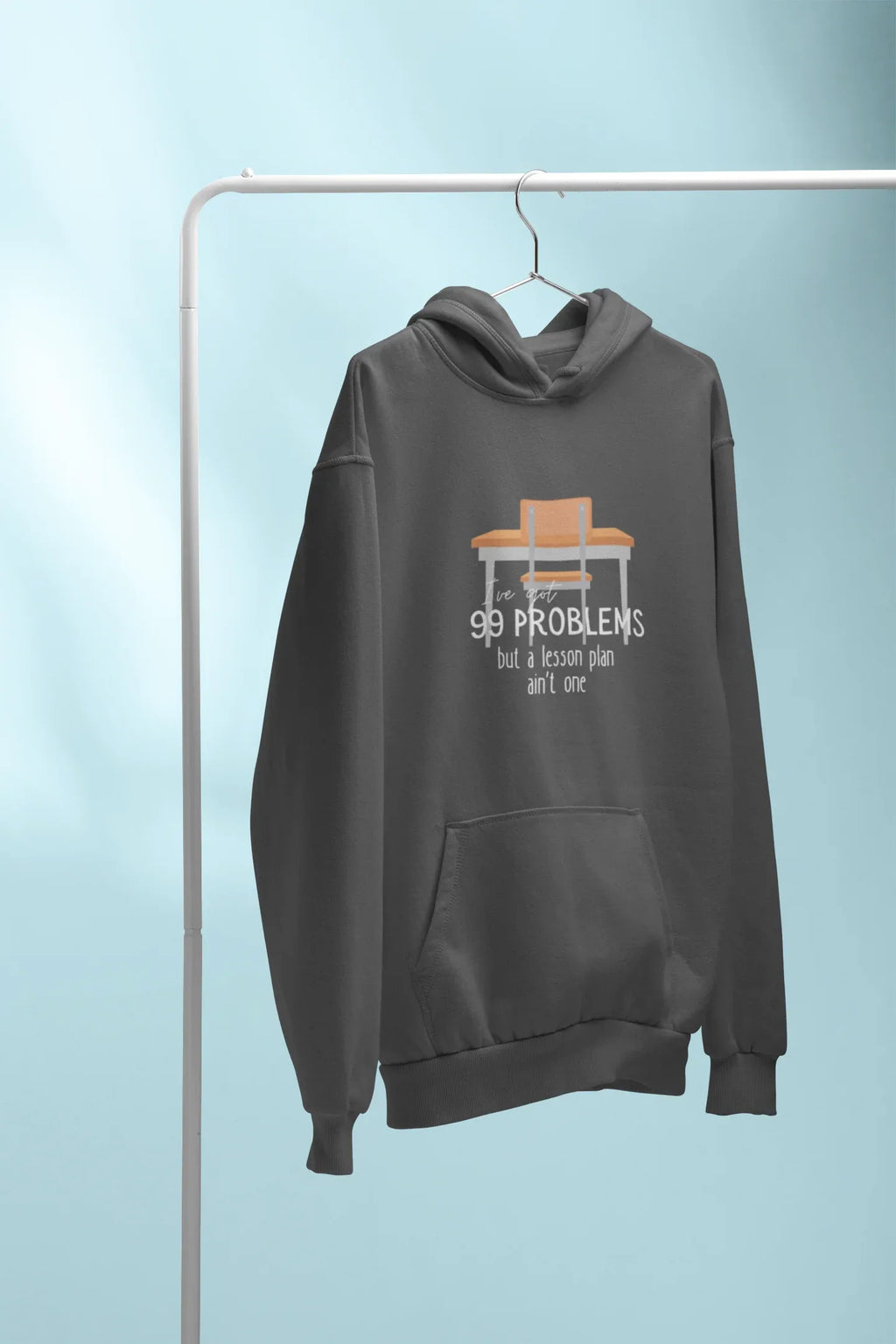Charcoal unisex hoodie on hanger; drawstring hood, front pocket, '99 problems' print.