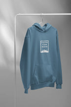 Light blue hoodie on hanger, with hood, kangaroo pocket, and square front faith print