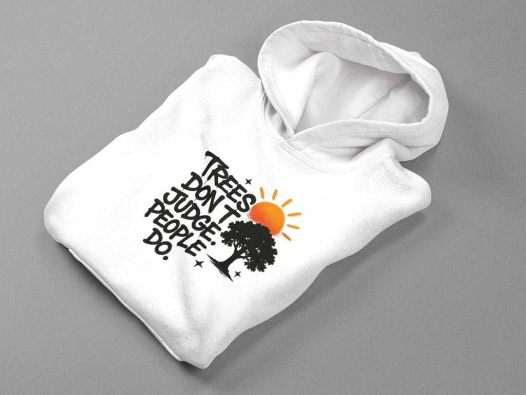 White pullover hoodie laid out, showing chest graphic with tree and text