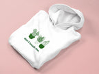 White hoodie with green cactus graphic and "don't touch me." text on the front