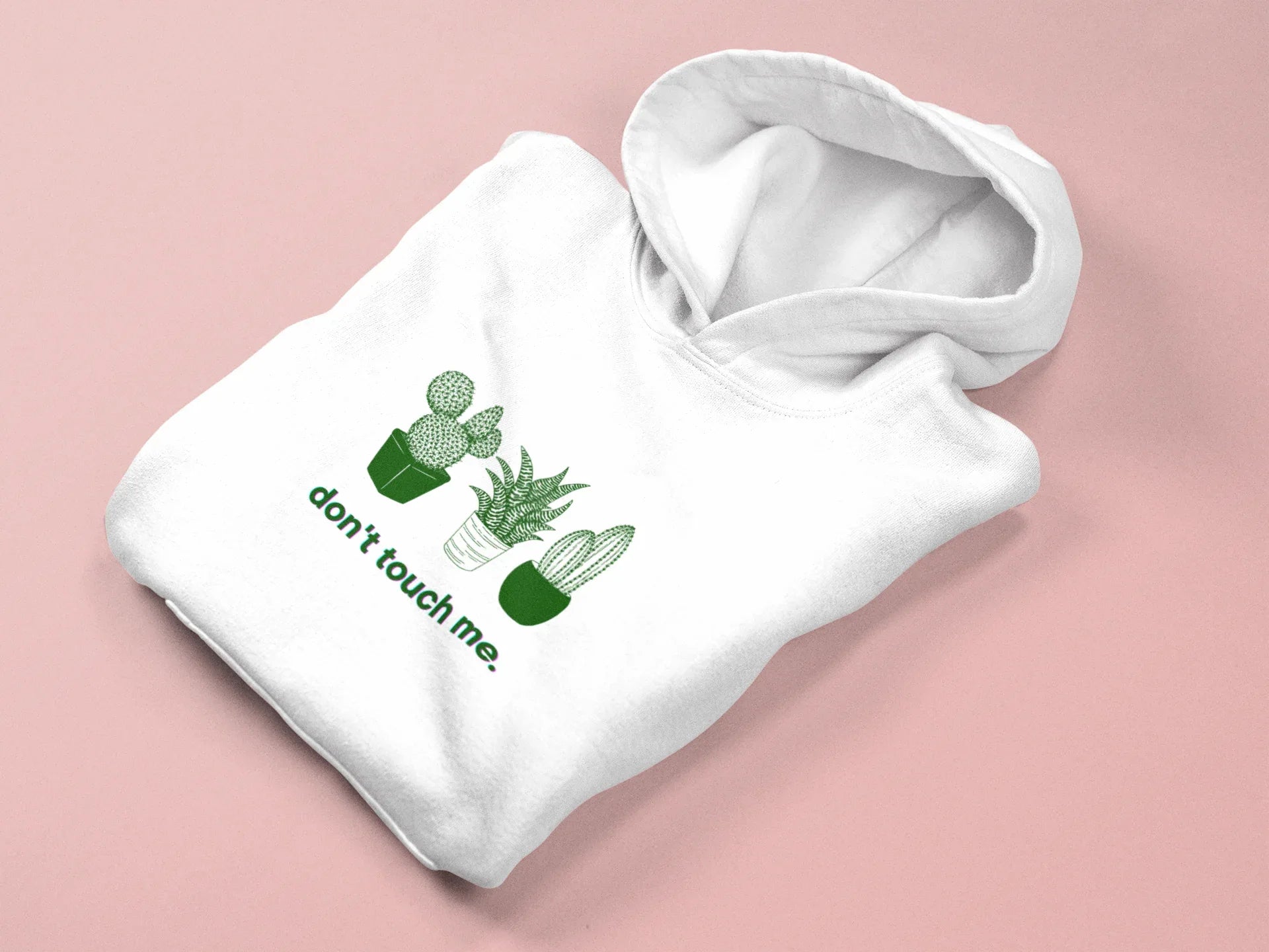 White hoodie with green cactus graphic and "don't touch me." text on the front
