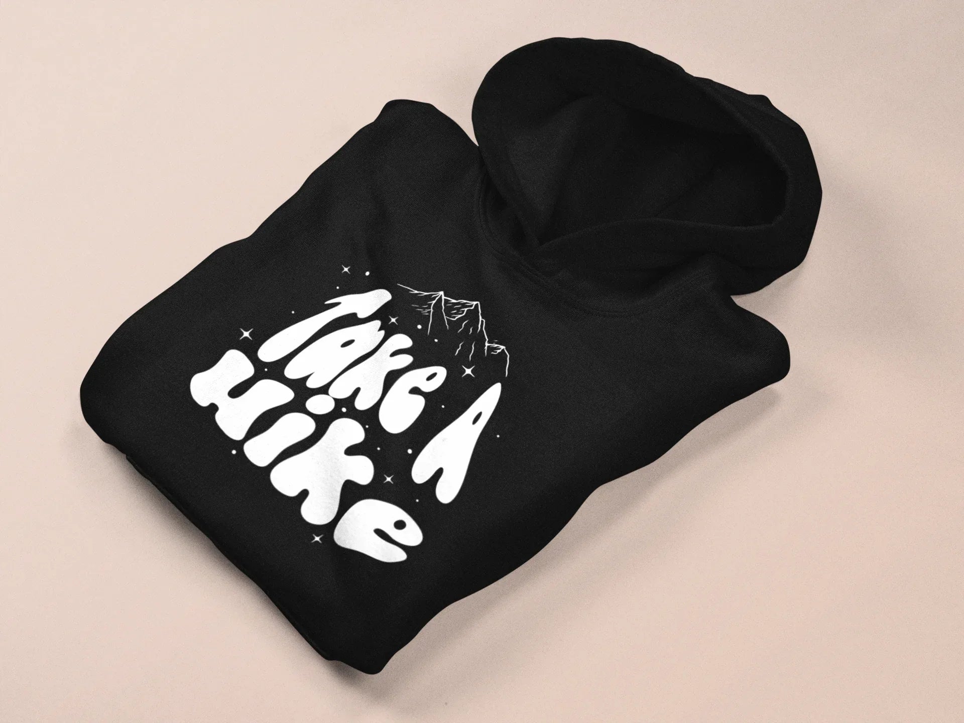 Black Take a Hike hoodie with hood and front Take a Hike mountain graphic, folded.