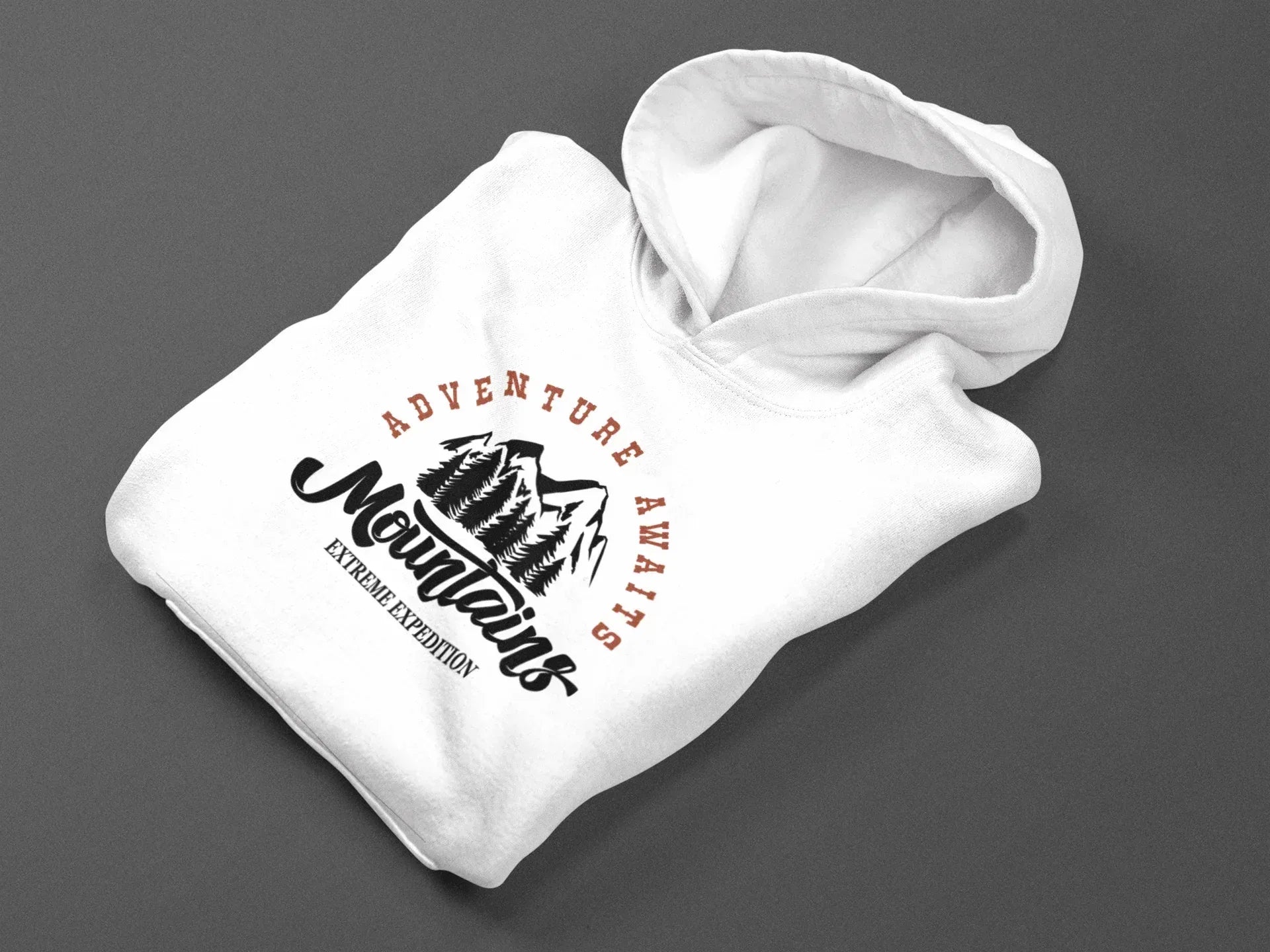 Folded white hoodie with Adventure Awaits mountain logo on front