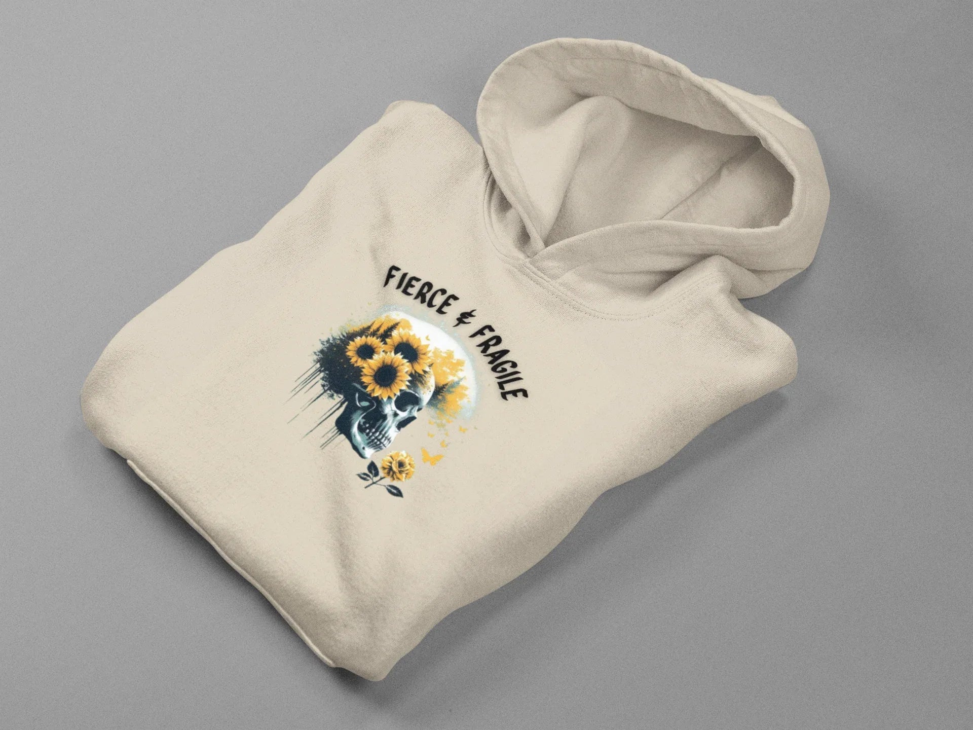 Cream hooded sweatshirt with sunflower skull graphic and Fierce & Fragile text