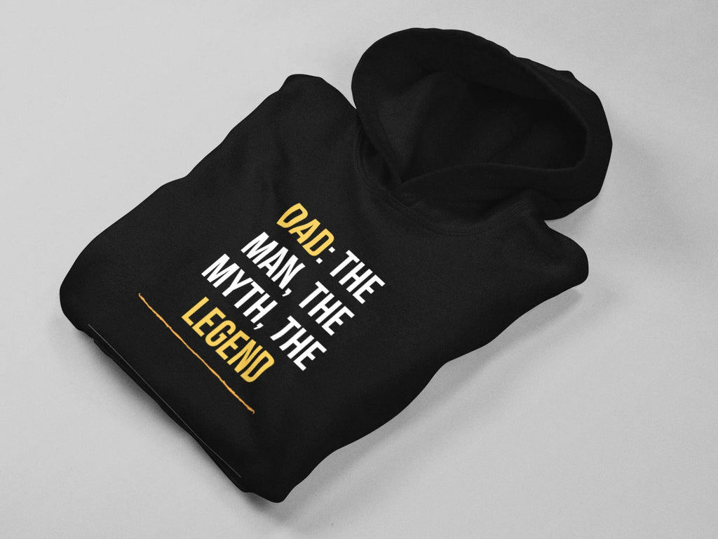 Black hoodie folded flat, showing hood and “DAD: THE MAN, THE MYTH, THE LEGEND”