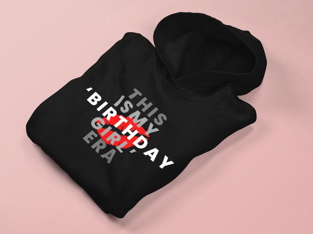 Black pullover hoodie folded with front text graphic and red birthday design