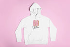 White kids pullover hoodie with hood, front pocket, and pink donut graphic on center.