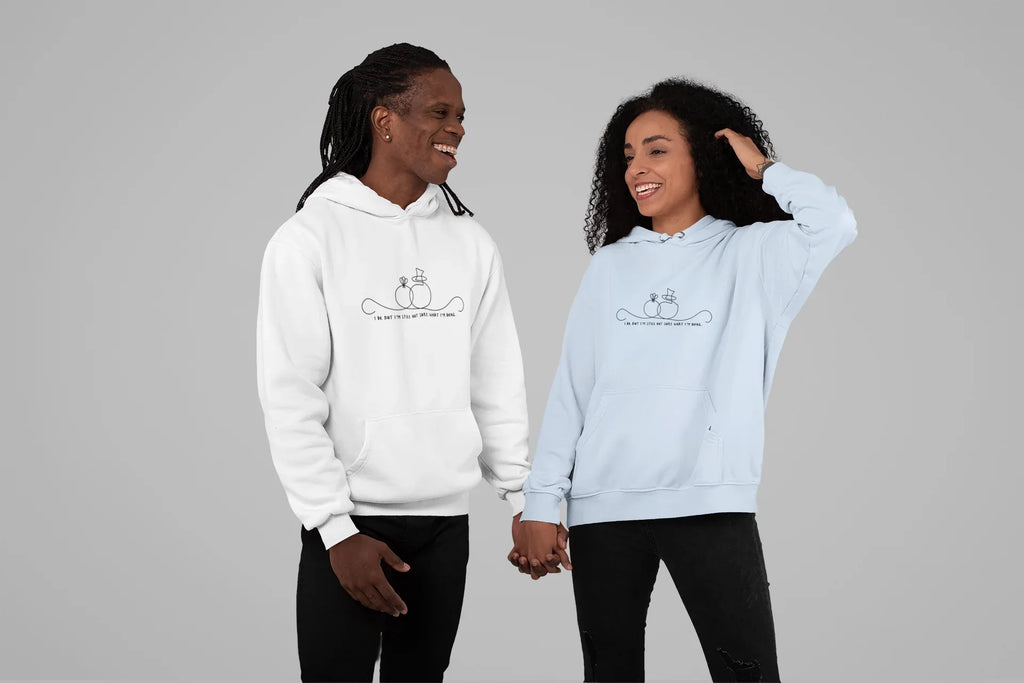 White and light blue unisex hoodies worn by two people, front line-art wedding graphic