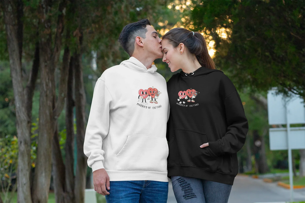 White and black hoodies worn by a couple, heart cartoon front prints