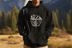 Black hoodie on person with front mountain graphic and hood drawstring visible