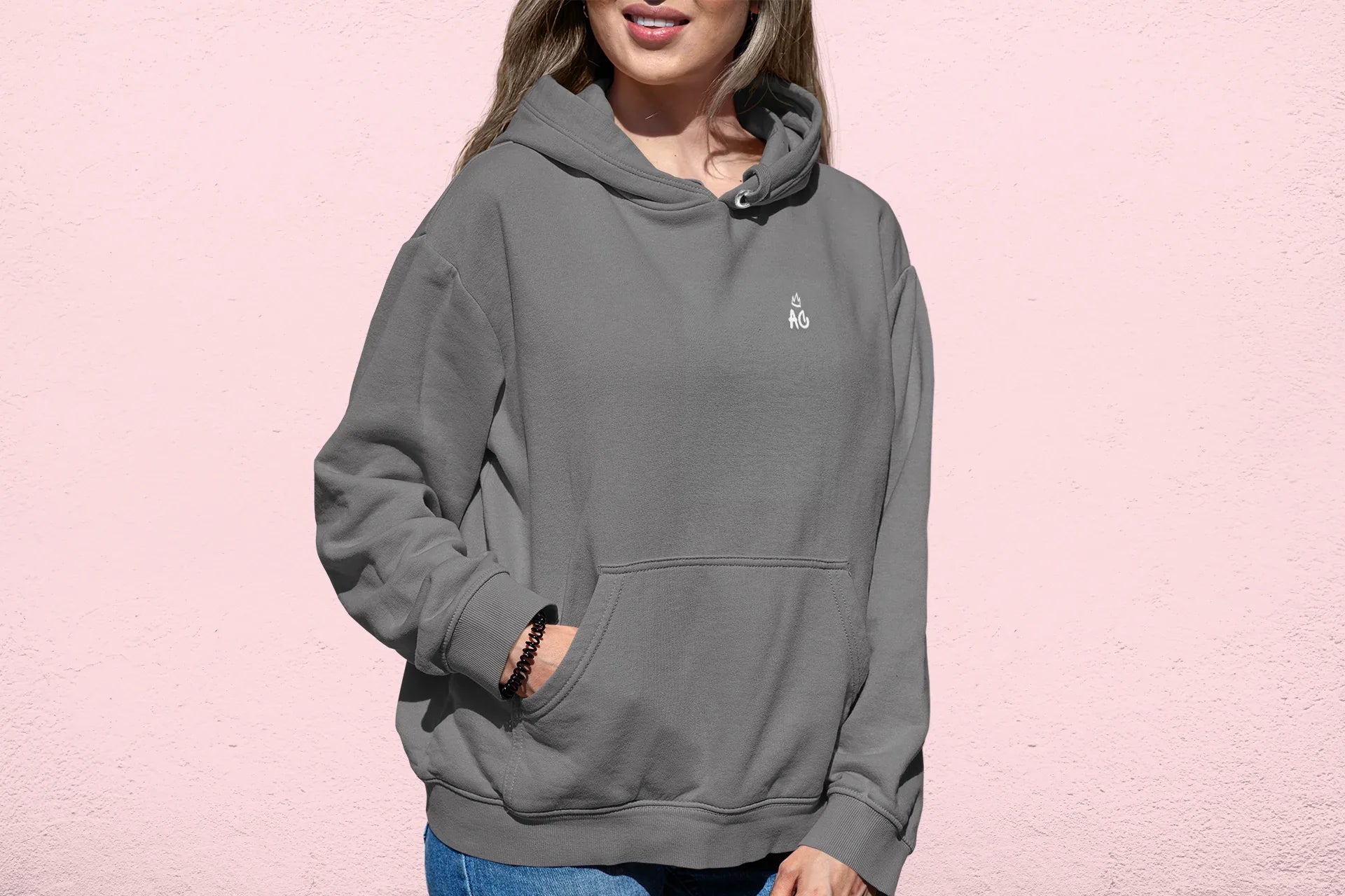 Steel gray pullover hoodie with small chest logo and hood