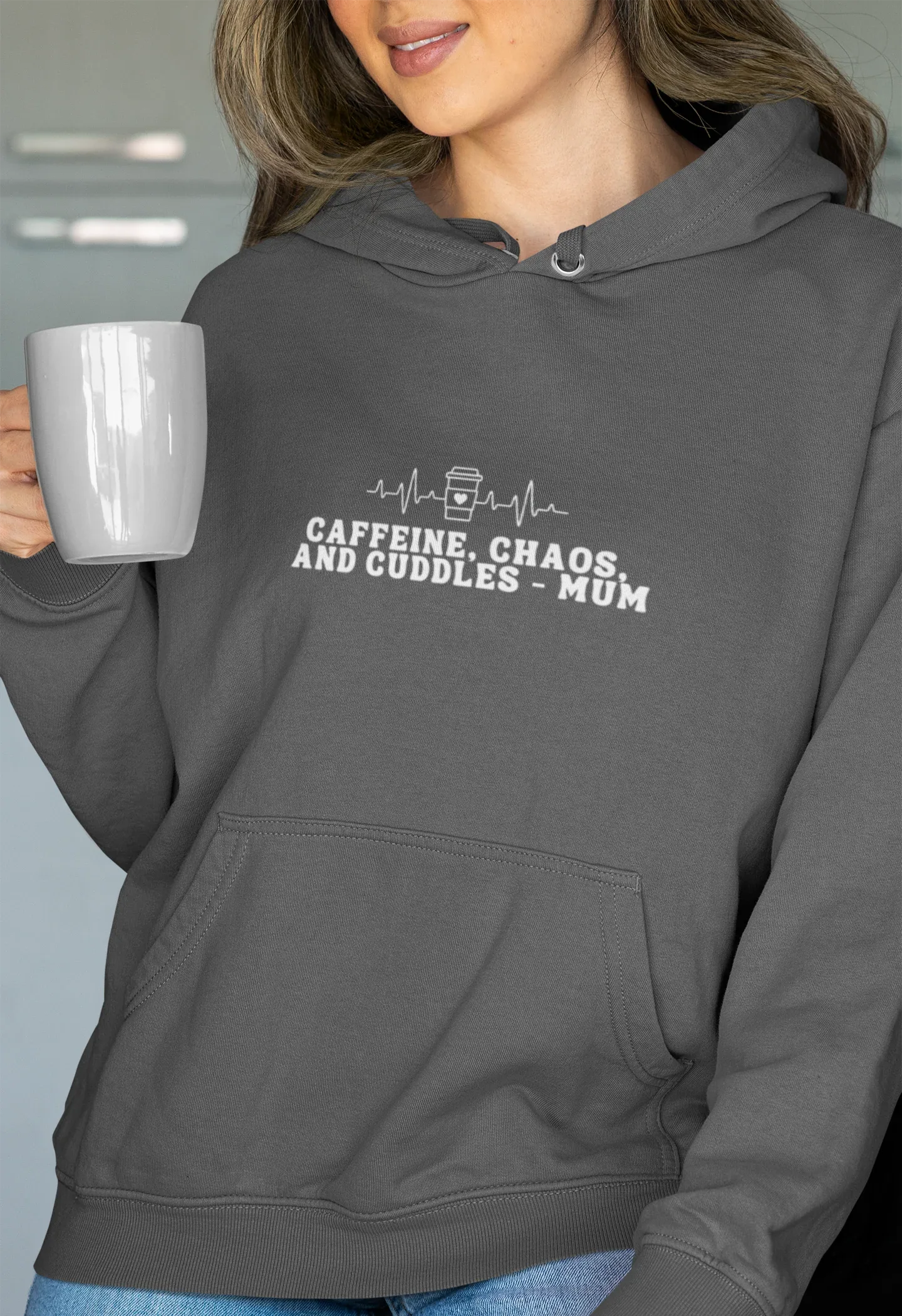 Charcoal hoodie sweatshirt with kangaroo pocket and 'Caffeine, Chaos, and Cuddles' text