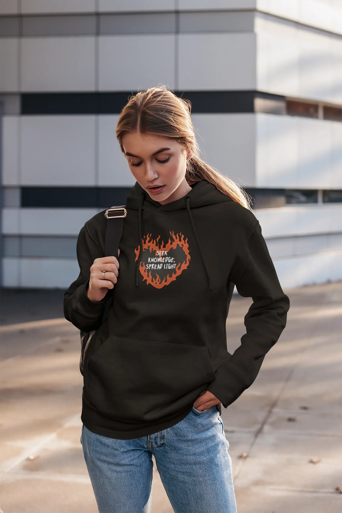 Black unisex hooded hoodie with orange flame logo on front and front pouch pocket