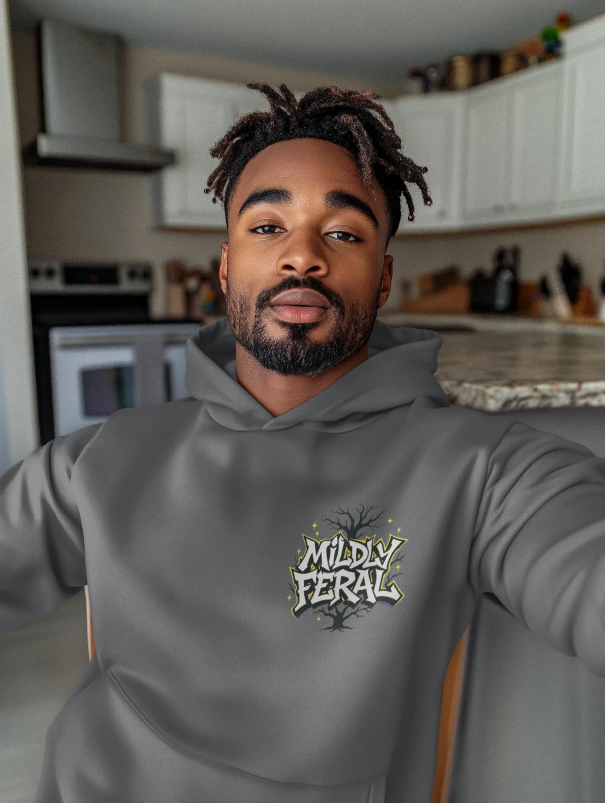 Dark gray graphic hoodie with a small chest “Mildly Feral” logo and front pouch pocket