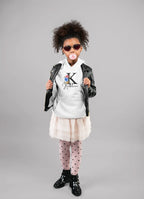 White kids hoodie on a child, floral letter and script name graphic centered on chest